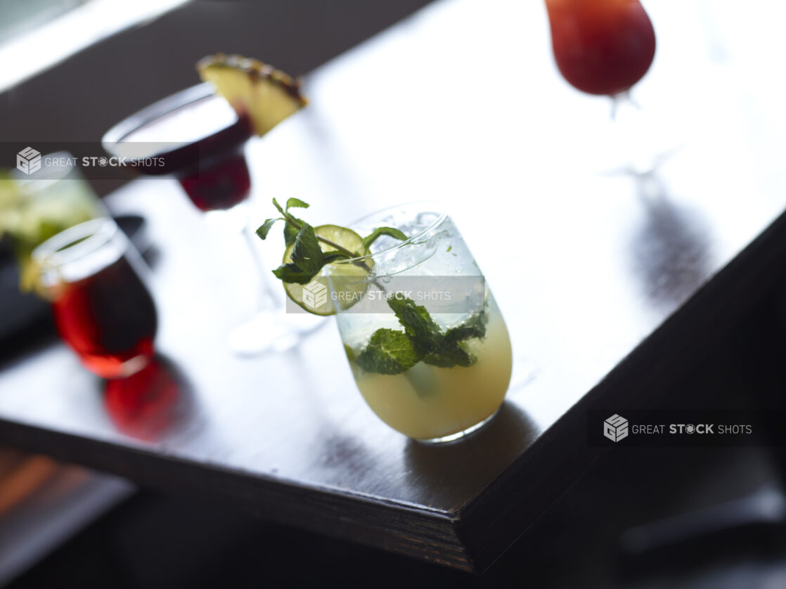 Mojito and Other Assorted Cocktails on Restaurant Table Setting