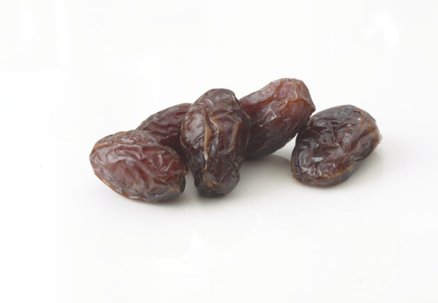 Whole dates in a grouping on a white background