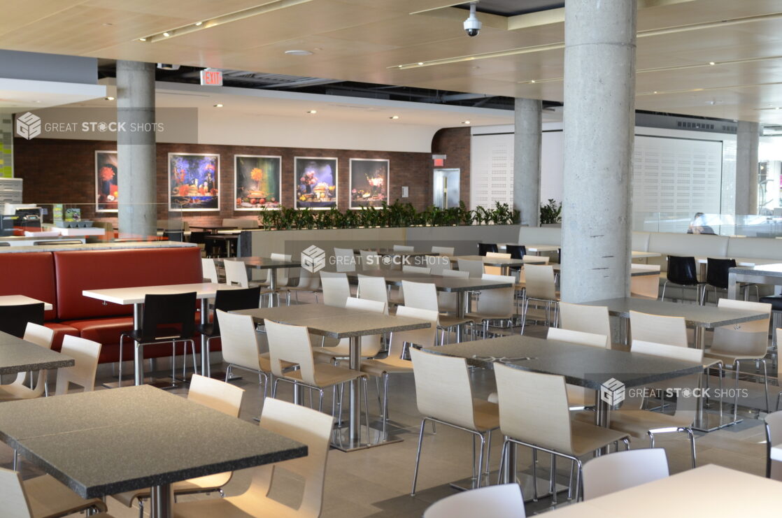 Empty food court with white tables, neutral palette