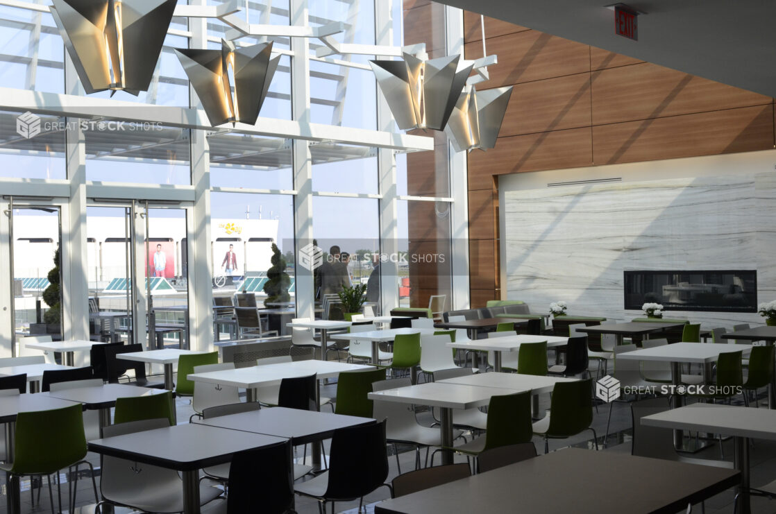 Empty food court with white tables, neutral palette