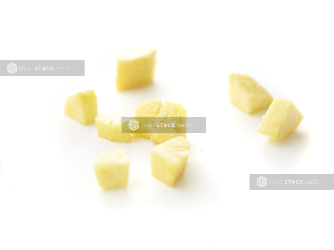 Chunks of Fresh Cut Pineapple Pieces Shot on White for Isolation