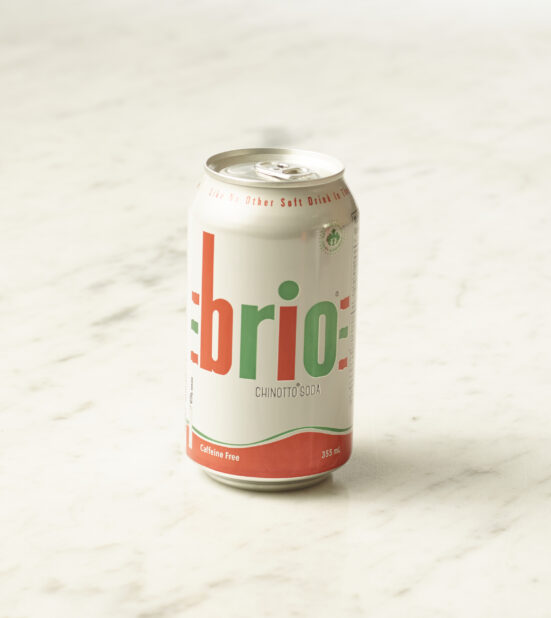 A can of Brio chinotto on a marble background