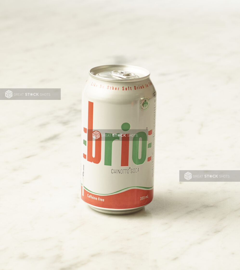 A can of Brio chinotto on a marble background