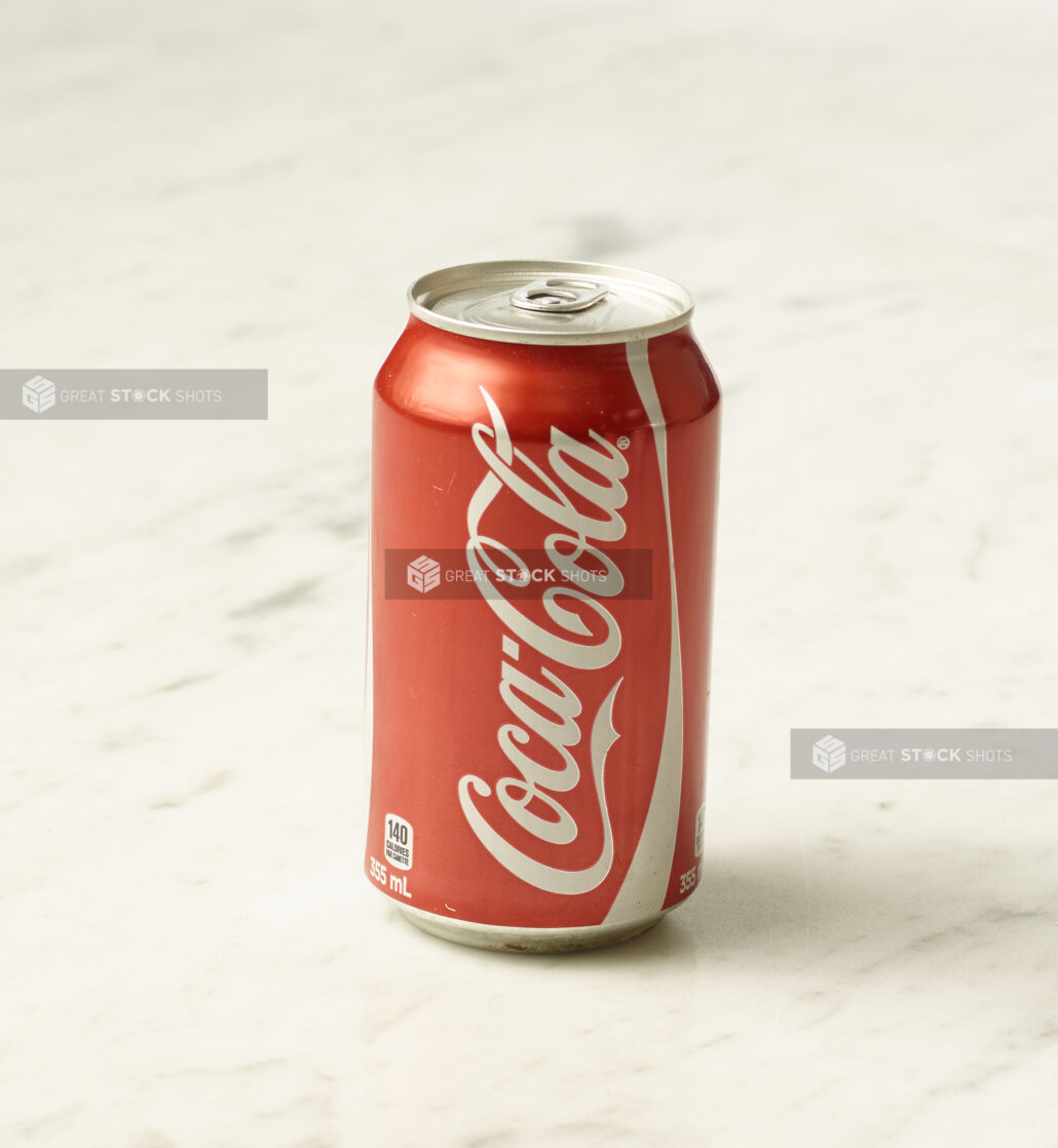 A can of original Coca-Cola on a marble background