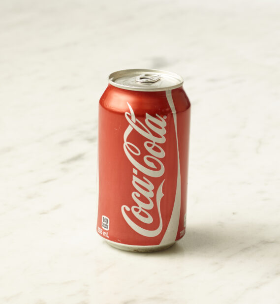 A can of original Coca-Cola on a marble background
