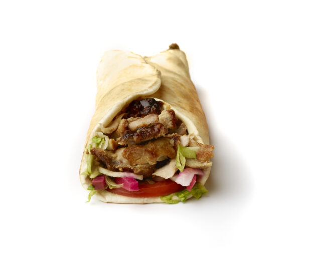 Chicken Shawarma Pita Wrap with Fresh Vegetable Toppings, Shot on White for Isolation