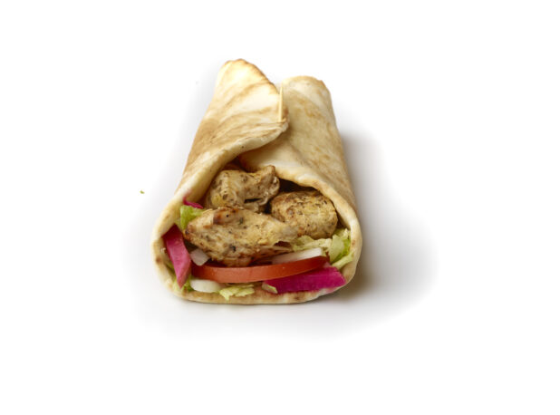 Chicken Souvlaki Pita Wrap with Fresh Vegetable Toppings, Shot on White for Isolation