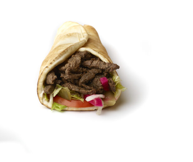 Beef Shawarma Pita Wrap with Fresh Vegetable Toppings, Shot on White for Isolation