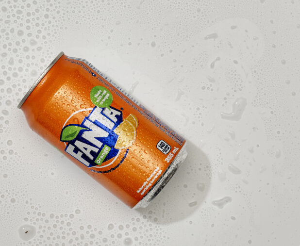 Overhead View of a Can of Fanta Orange Sparkling Beverage, on a White Background for Isolation