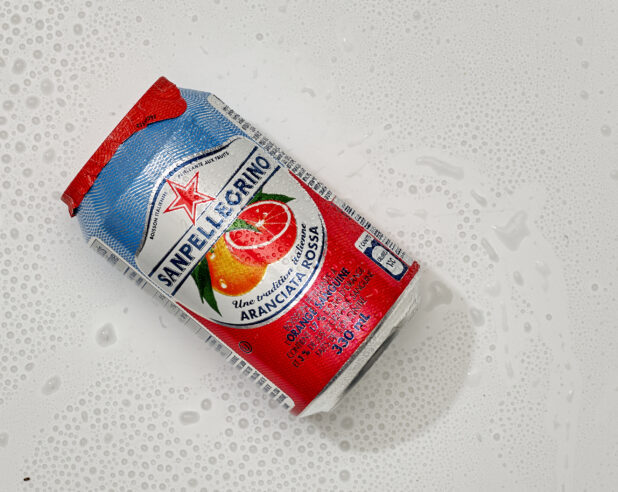 Overhead View of a Can of San Pellegrino Aranciata Rossa Orange Sparkling Beverage on a White Background for Isolation