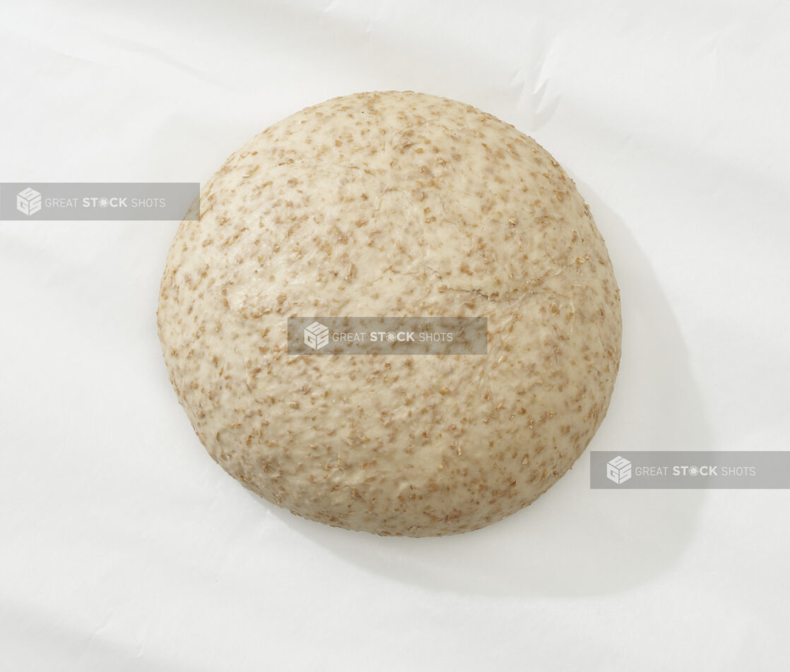 Overhead View of a Whole Wheat Pizza Dough Ball, on a White Background for Isolation