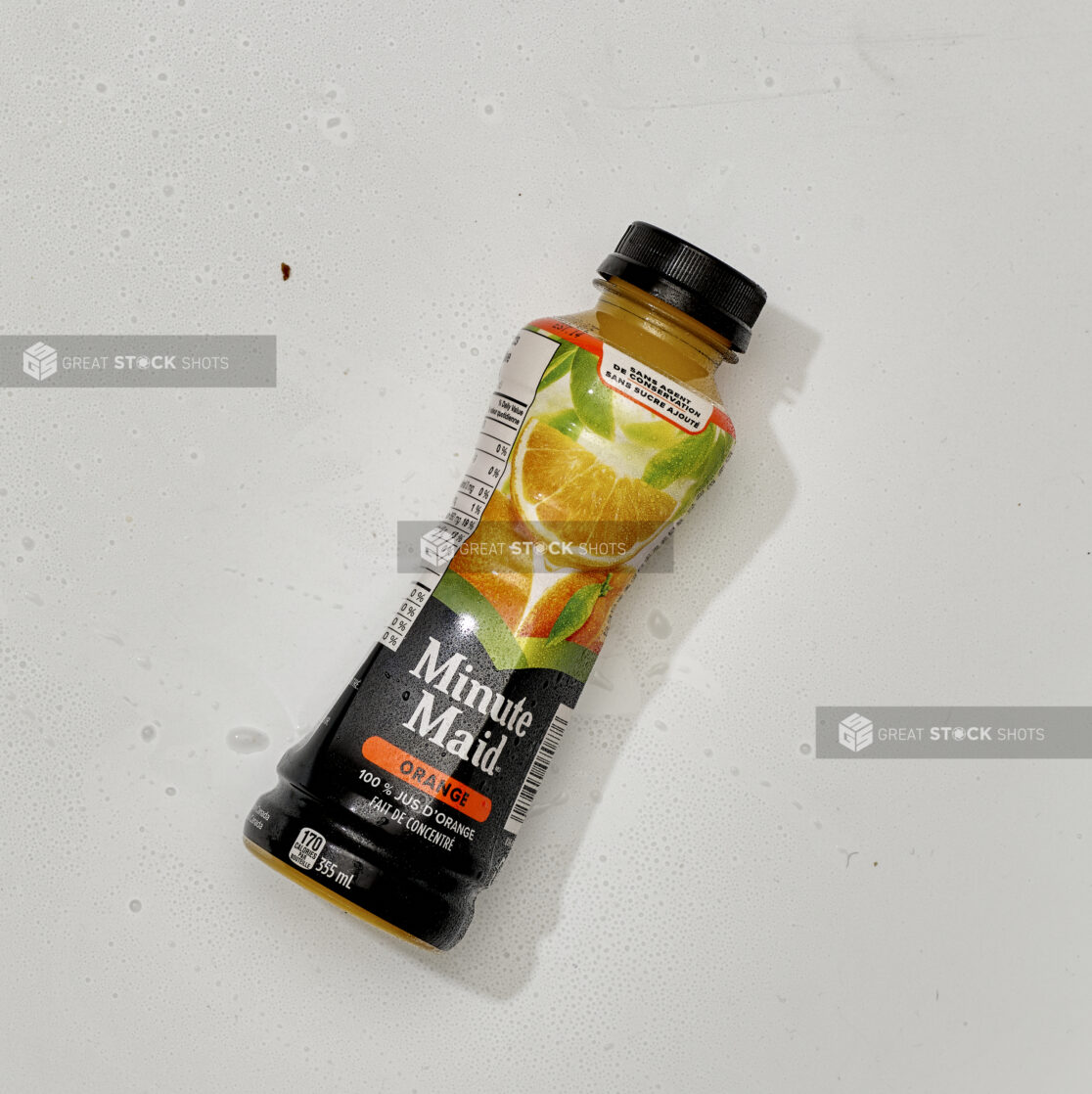 Overhead View of Minute Maid Brand Orange Juice in a Plastic Bottle, on a White Background for Isolation