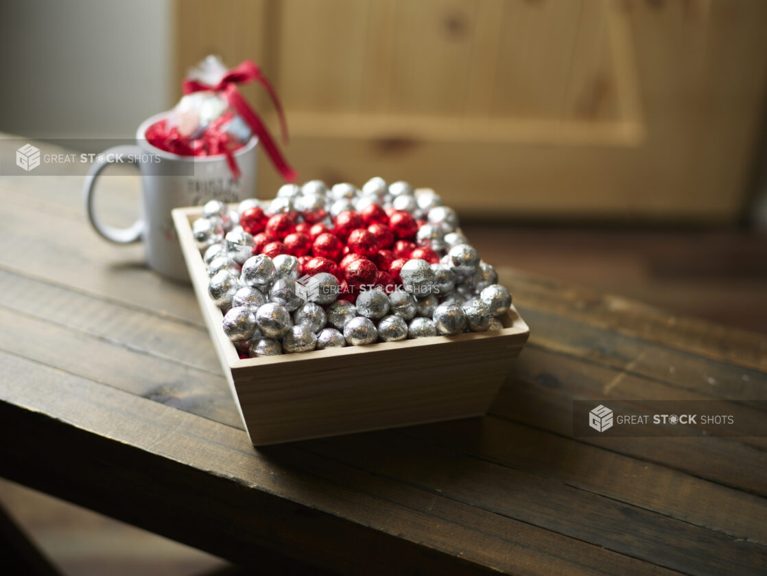 Valentine's Day gift box with red and silver chocolate foil balls and accompanying mug