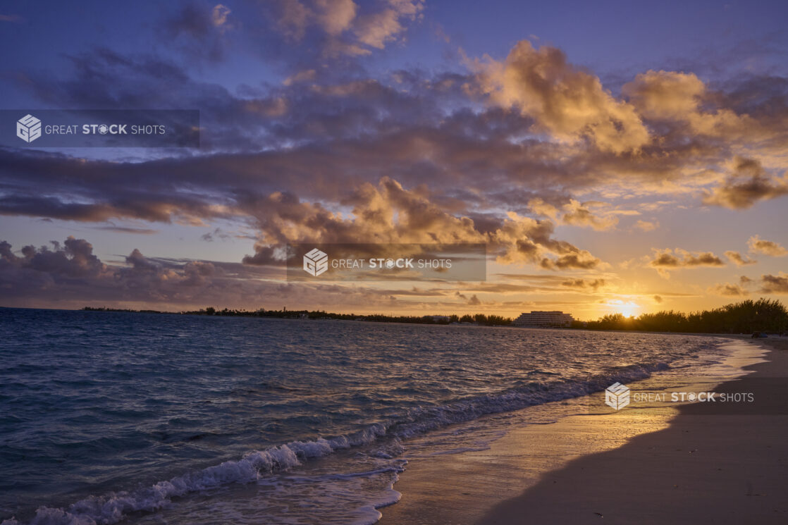 Landscape View of a Sandy Tropical Beach Shoreline and Waves at Sunset or Sunrise in Nassau, Bahamas - variation