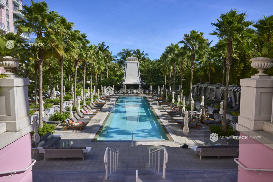 Large Poolside Lounging Area Surrounded by Palm Trees in a Resort Hotel in Nassau, Bahamas