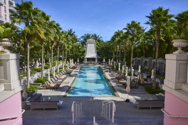 Large Poolside Lounging Area Surrounded by Palm Trees in a Resort Hotel in Nassau, Bahamas