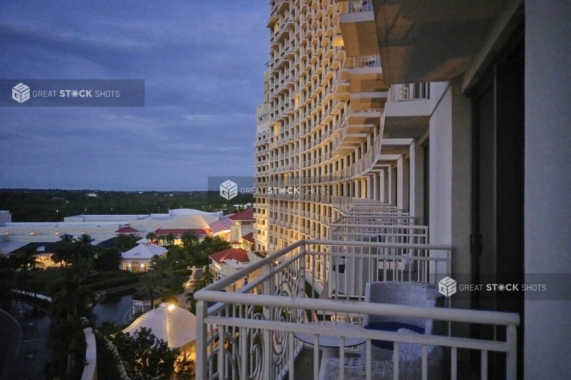 Exterior View of Resort Hotel Balconies Overlooking Shops, Restaurants and Palm Trees in Nassau, Bahamas