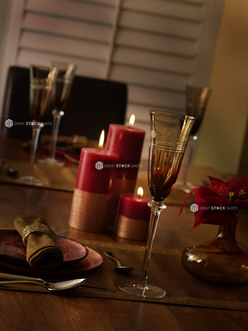 Close Up of a Formal Table Setting on a Wooden Table in a House Decorated with Holiday and Christmas Decorations