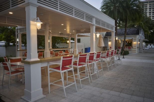 Communal Seating and Counter Seating of a Poolside Bar Area in a Resort in Nassau, Bahamas at Dusk