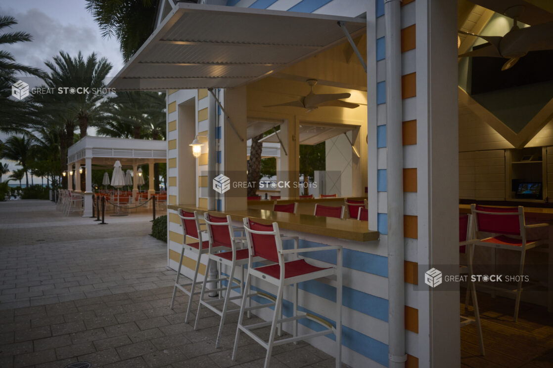 Colourfully Painted Poolside Cabanas, Kiosks and Bars at Dusk on a Hotel Resort in Nassau, Bahamas - Variation