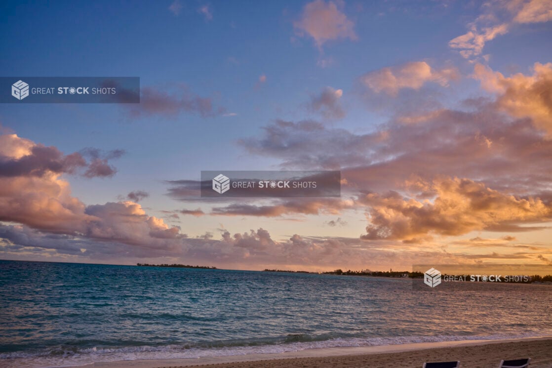 Landscape View of a Sunset Over the Blue Waters on a Sandy Beach in a Resort in Nassau, Bahamas at Dusk