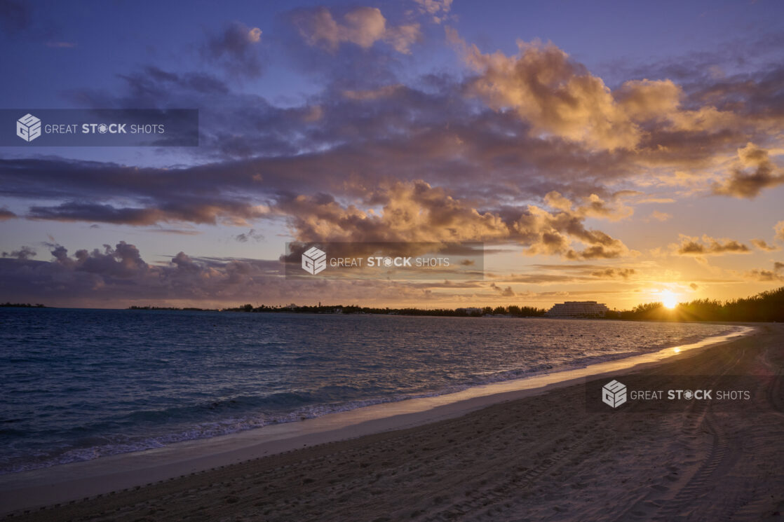 Landscape View of a Sandy Tropical Beach Shoreline and Waves at Sunset or Sunrise in Nassau, Bahamas - Variation 2