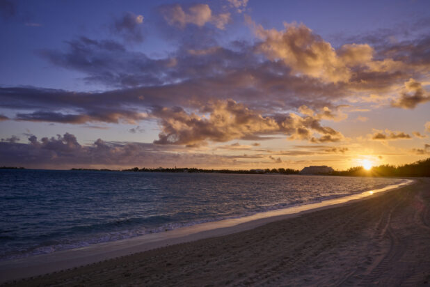 Landscape View of a Sandy Tropical Beach Shoreline and Waves at Sunset or Sunrise in Nassau, Bahamas - Variation 2