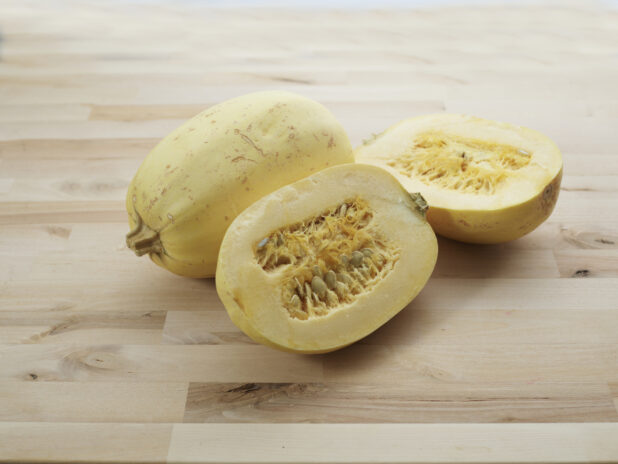 Winter squash, halved and whole, close-up