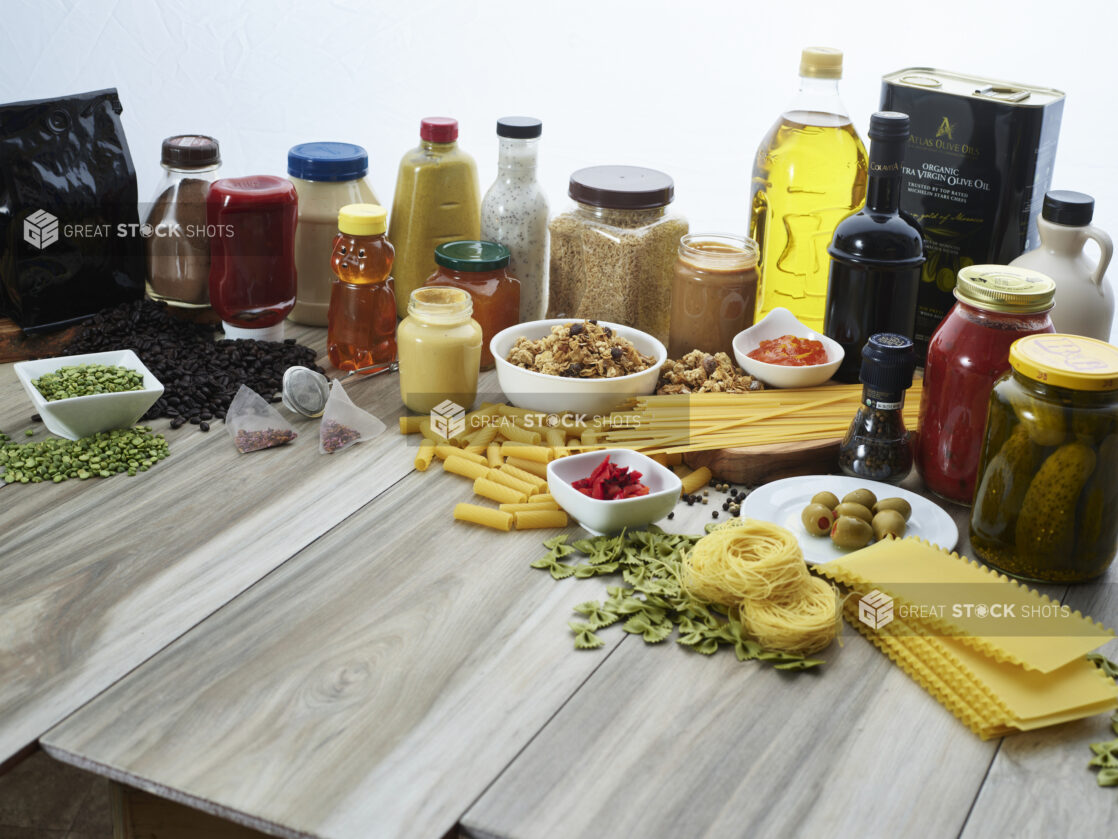 Spread of assorted dry, bottled, and canned pantry staples