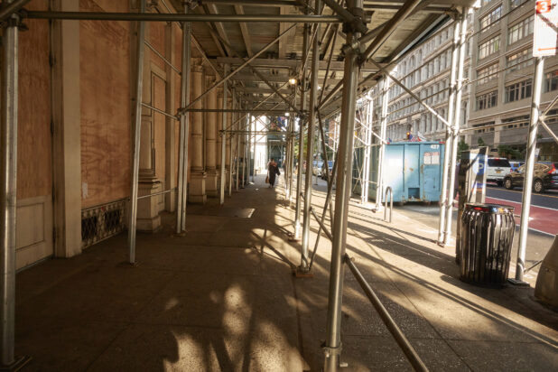 View Down an Empty City Street Under Scaffolding During the Pandemic Lockdown in New York City