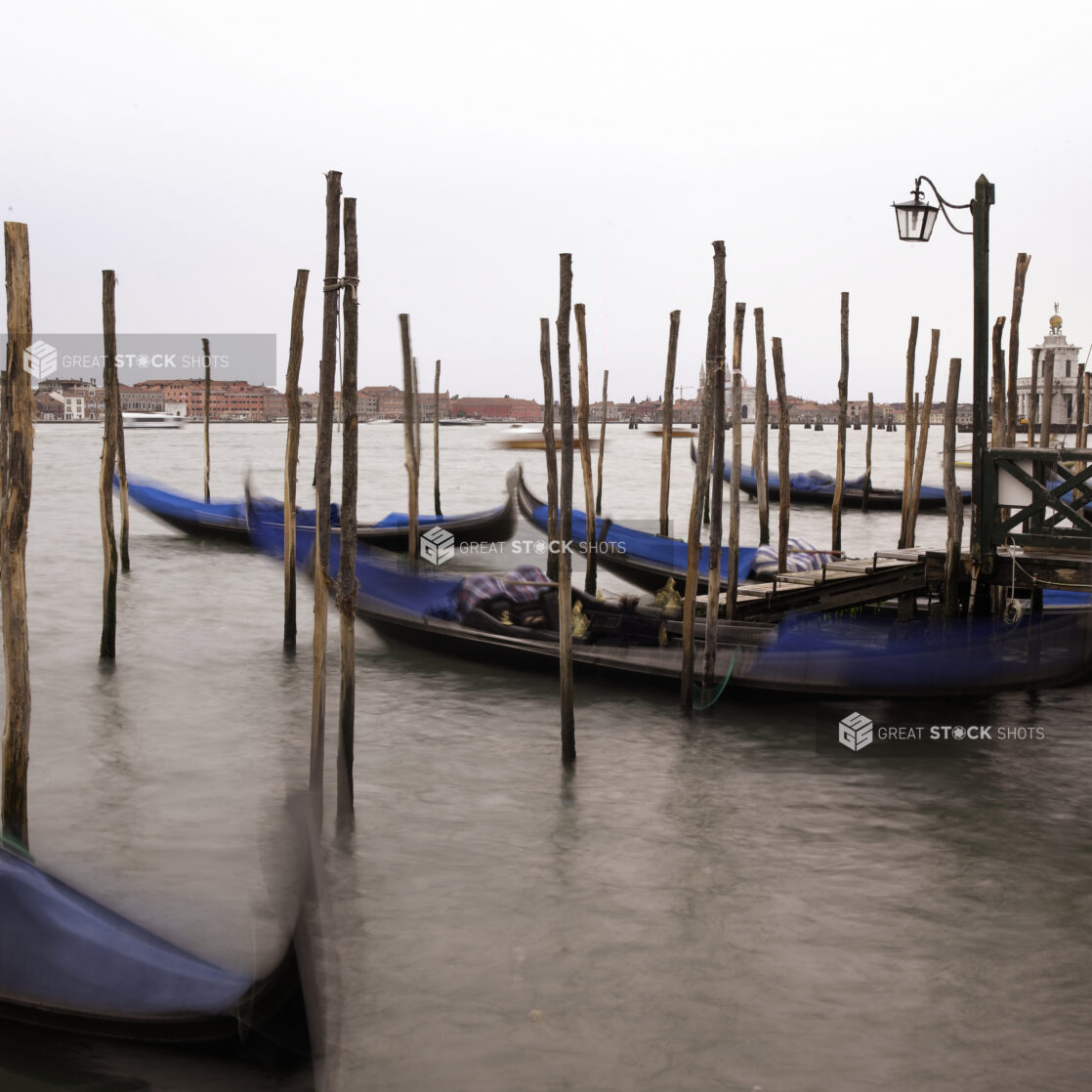 Gondolas Moored Along a Pier in Venice, Italy