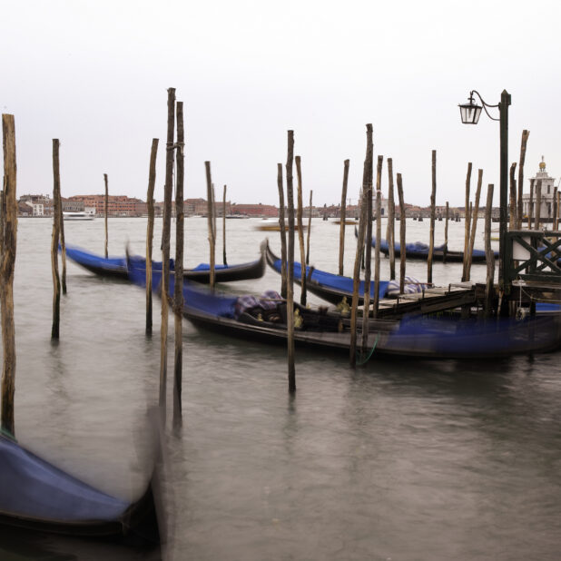 Gondolas Moored Along a Pier in Venice, Italy