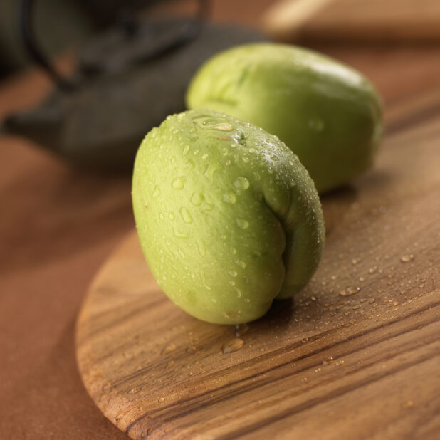 Close Up Whole Chayote Gourd on a Wooden Board