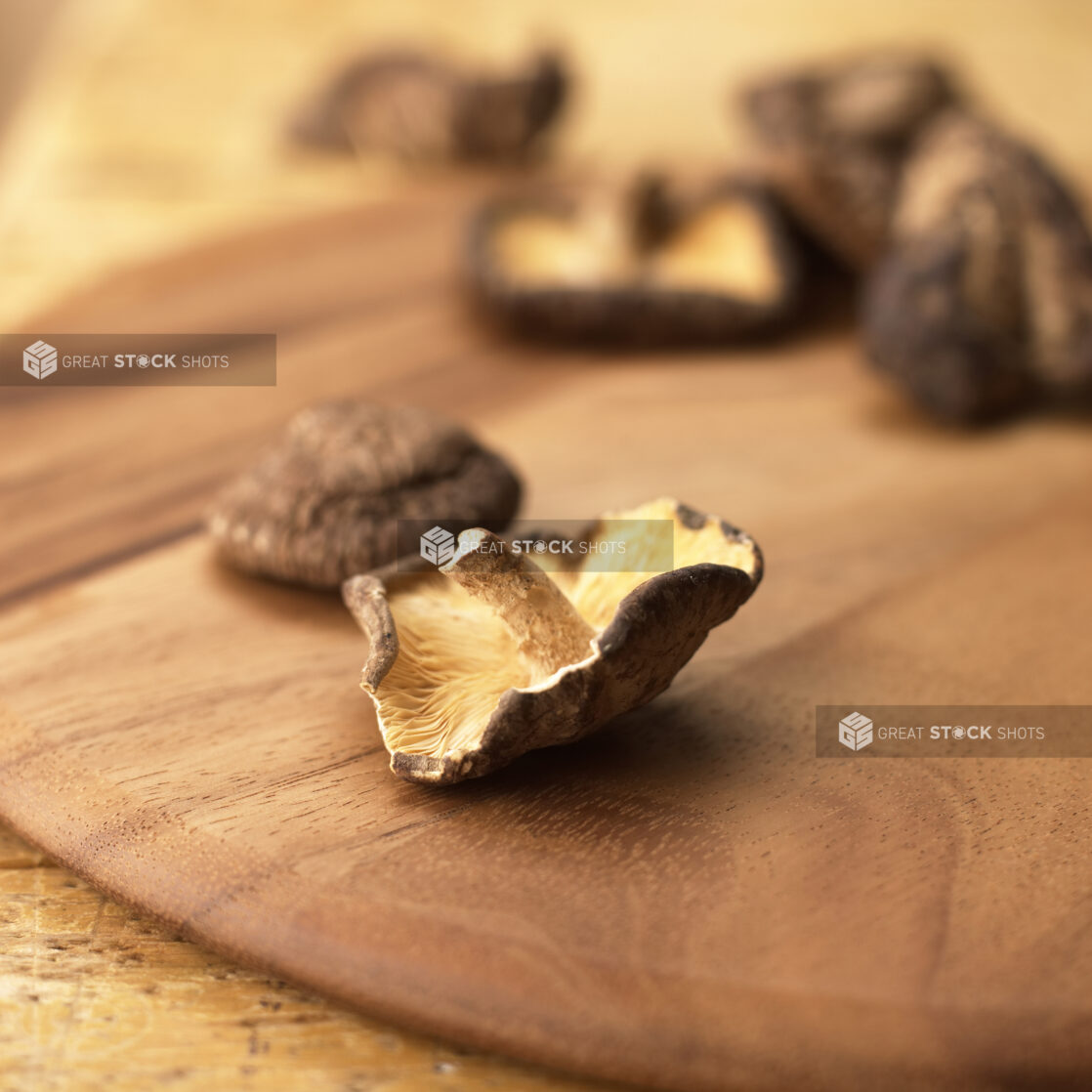 Close Up Shot of Dried Shiitake Mushrooms on a Wooden Board