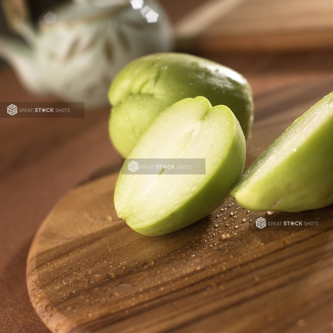 Close Up Sliced Chayote Gourd on a Wooden Board