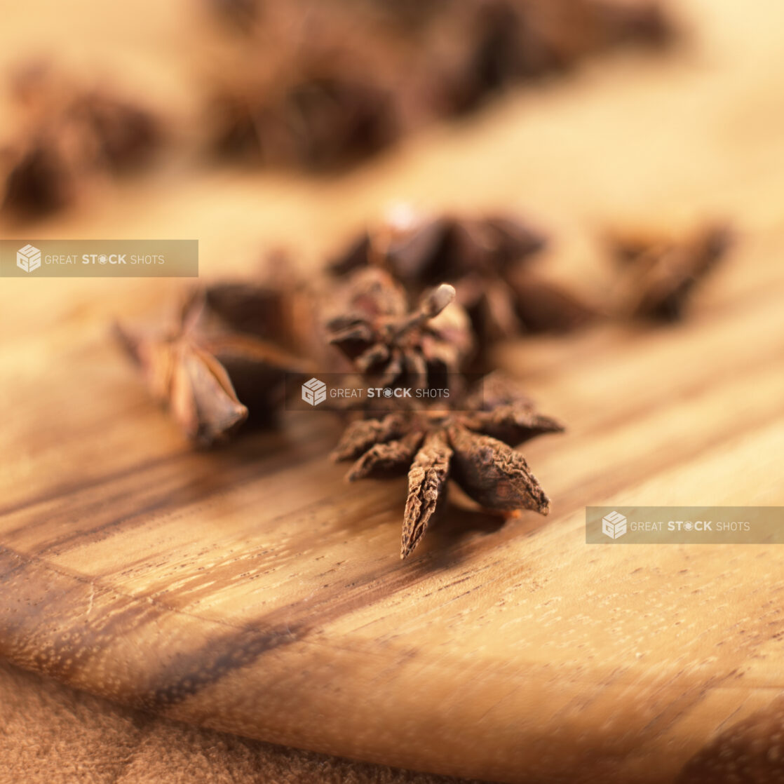 Close Up of Dried Star Anise Spice on a Wooden Board