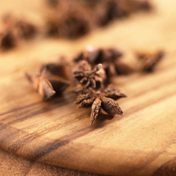 Close Up of Dried Star Anise Spice on a Wooden Board