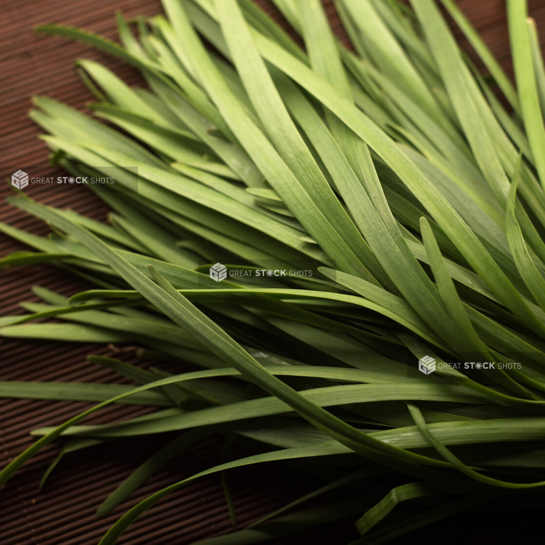 Overhead Shot of Pandan Leaves on a Dark Wooden Table