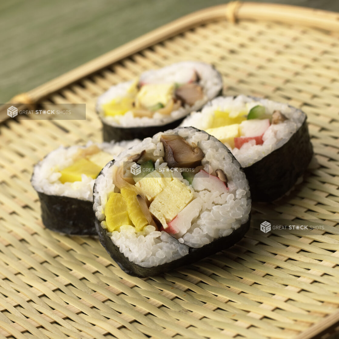 Close Up of Futomaki Sushi Rolls with Traditional Japanese Egg Omelet, Pickled Turnip, Imitation Crap and Shiitaki Filling