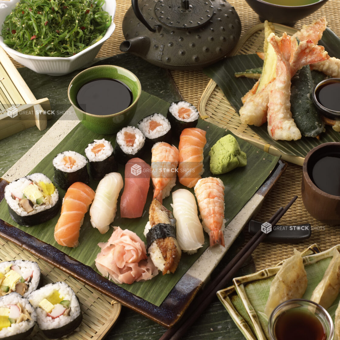 Assorted Sushi Platter with Popular Nigiri and Maki Sushi with Pickled Ginger, Soy Sauce and Wasabi Paste on the Side