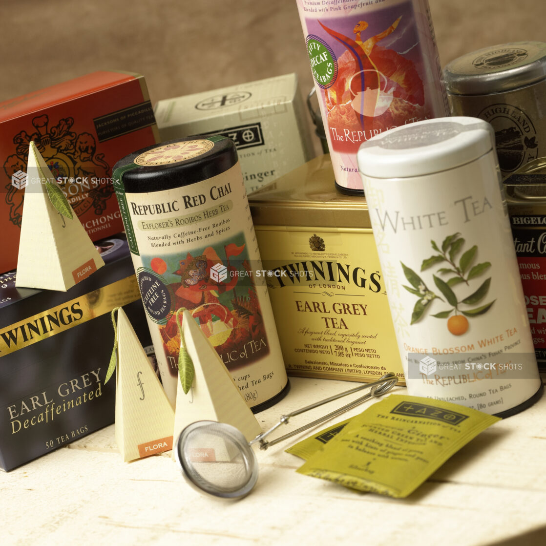 Assorted Gourmet Teas in Boxes and Canisters in a Gourmet Grocery Store Setting