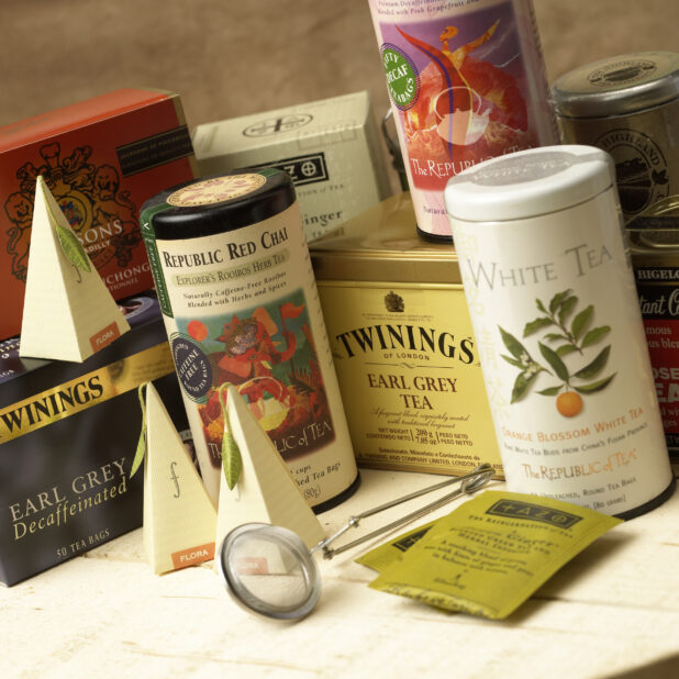 Assorted Gourmet Teas in Boxes and Canisters in a Gourmet Grocery Store Setting