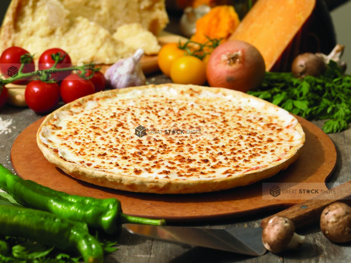 Thin Crust Cheese Pizza on a Wooden Pizza Peel in an Indoor Setting