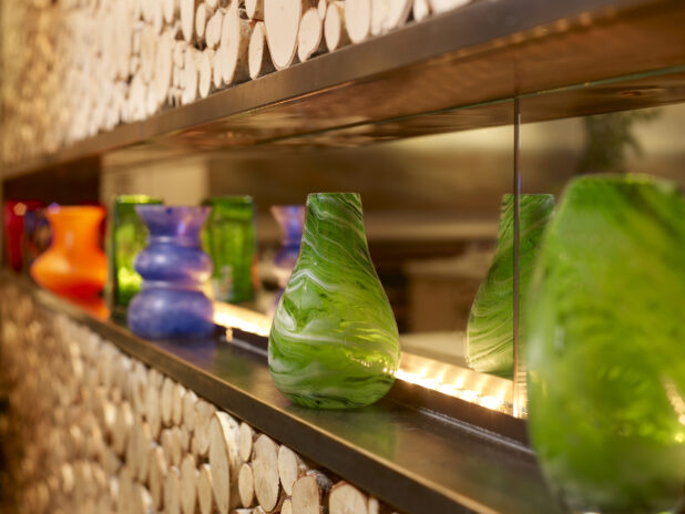 Close Up of Decorative and Colourful Blown Glass Vases in a Restaurant Interior Display