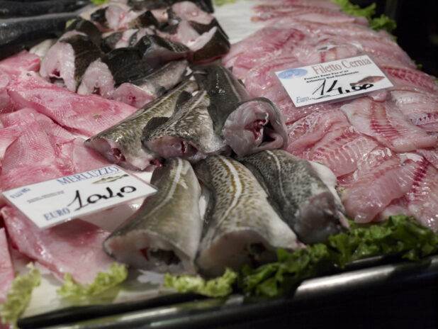 Close Up of an Assortment of Cut Fish Fillet at a Seafood Stall in an Outdoor Market in Venice, Italy
