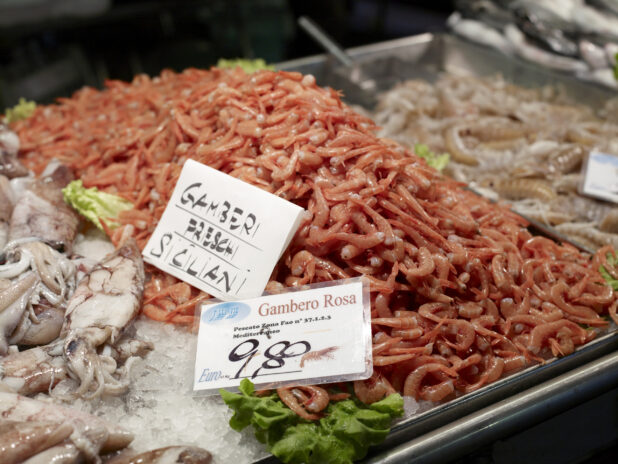 Fresh Partially Peeled Pink Shrimp at a Seafood Stall in a Food Market in Venice, Italy