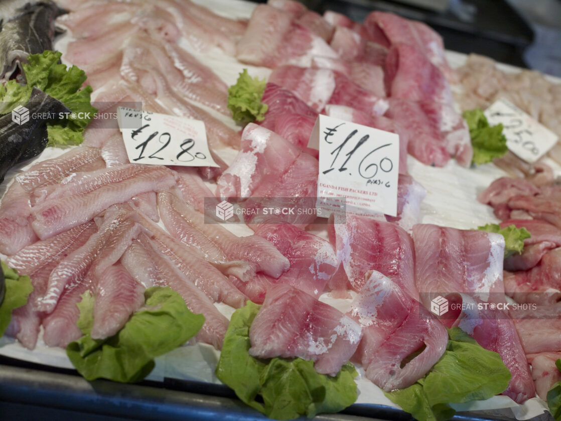 Assorted Cuts of Fresh Fish Fillets at a Seafood Stall in a Food Market in Venice, Italy