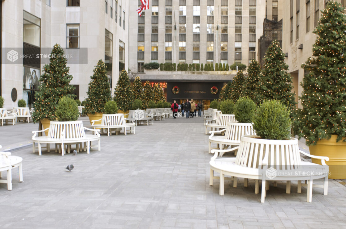 Park Benches and Christmas Trees in a Plaza at Rockefeller Center in Manhattan, New York City