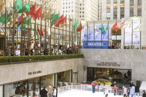 View into the Outdoor Ice Rink in the Lower Plaza of the Rockefeller Center during Christmas in Manhattan, New York City