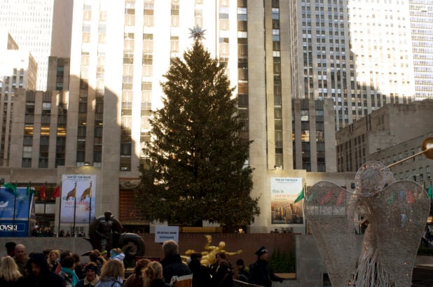 View of Christmas Tree Behind the Prometheus Sculpture in Rockefeller Center in Manhattan, New York City
